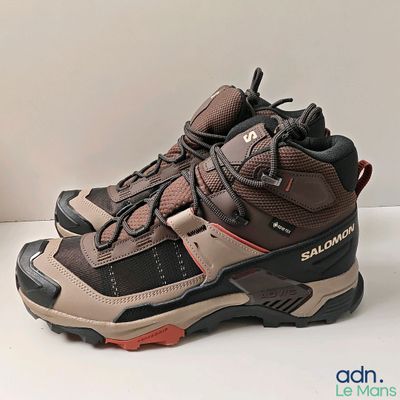 a close up of a pair of hiking shoes on a table