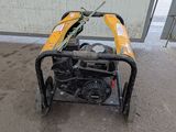 an image of a small generator in a parking lot
