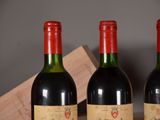 three bottles of wine sitting next to each other on a table