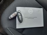 two car keys sitting on top of a piece of paper