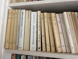 many books that are on the shelves in the room