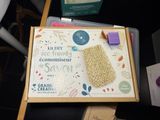 a cardboard box with some items on it on a table
