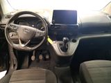 a picture of a car dashboard with a cell phone in it