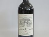 a bottle of wine that is sitting on a table