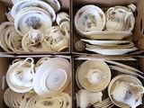 many plates and bowls in a box together