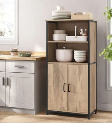 an image of a kitchen with a wooden cabinet and white dishes