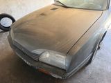 a dirty car that is parked in a garage