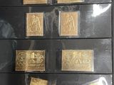 several different types of stamps are on display in a display case