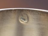 close up of a metal pot with a metal lid and a small hole in the bottom