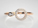 a close up of a diamond ring on a white surface