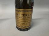 a bottle of wine that is sitting on a table