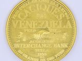 an image of a gold coin with a picture of a bird on it