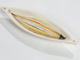 a white plate with a colorful striped design on it