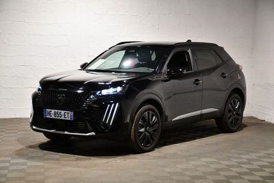 the black suv is parked in a garage with a checkered floor