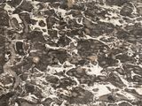 a black and white marble counter top in a kitchen