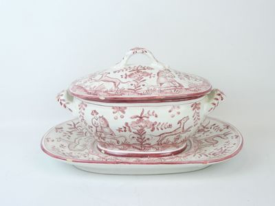 an image of a tureeny dish and saucer