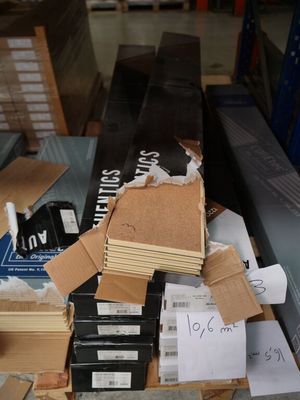 a pile of cardboard and other items on a table