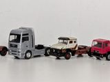 a lot of toy cars that are lined up on a table