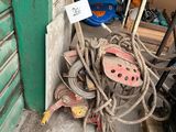 a pile of rope next to a pile of shoes in a garage