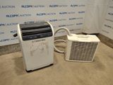 a small air conditioner sitting next to a small air conditioner