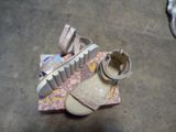 a pair of shoes that are on top of a box