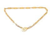 a close up of a gold chain with a heart on it