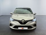 the front view of a silver car in a showroom