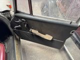 a door of a car that has a handle on it