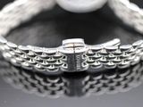 bracelet on a black surface with reflection on the surface