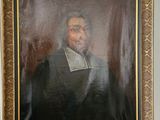 portrait of a man in a black suit and white shirt