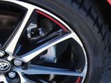 a close up view of a car ' s wheel and tire