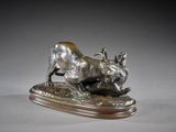 an image of a bronze sculpture of a dog on a wooden base