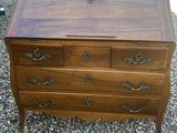 a wooden desk with drawers and a drawer on top of it