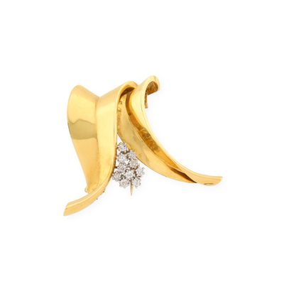 an image of a pair of gold earrings with diamonds on a white background