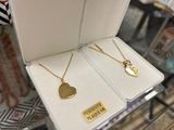 two necklaces that are on display in a box