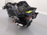 a motorcycle with a toolbox on the back of it