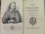 un vieux livre sur lequel figure l'image d'un homme tenant un livre