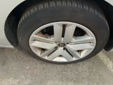 a close up of a car ' s tire on the street
