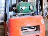 a forklift truck that is parked inside of a building