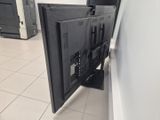 a flat screen tv mounted on a wall in a room