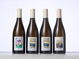 three bottles of wine sitting on top of a table next to each other