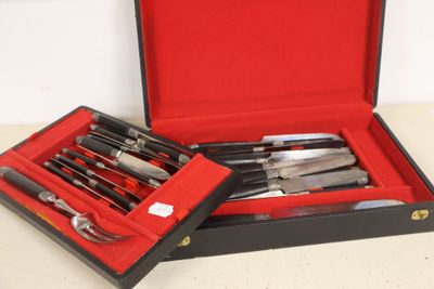 a box with knives and knives in it on a table
