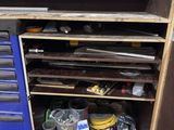 a workbench with a lot of tools on top of it