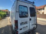 a white van that is parked on the side of the road