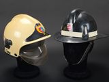 two fire fighters helmets sitting on top of each other on a mannequin head