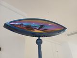 a mirror that is sitting on top of a stand