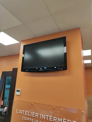 a flat screen tv mounted on the wall in a room