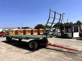 a flatbed truck with a trailer attached to it
