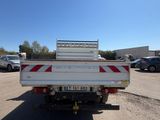 a white truck that is parked in a parking lot