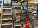 a fire extinguisor in the middle of a warehouse